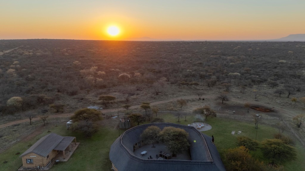 Lodge at golden hour — aerial panorama