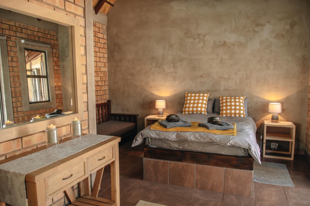 En-suite bedroom — king bed and safari décor